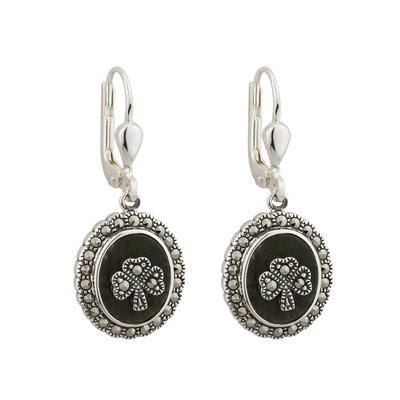 A pair of earrings with a black stone and silver frame.