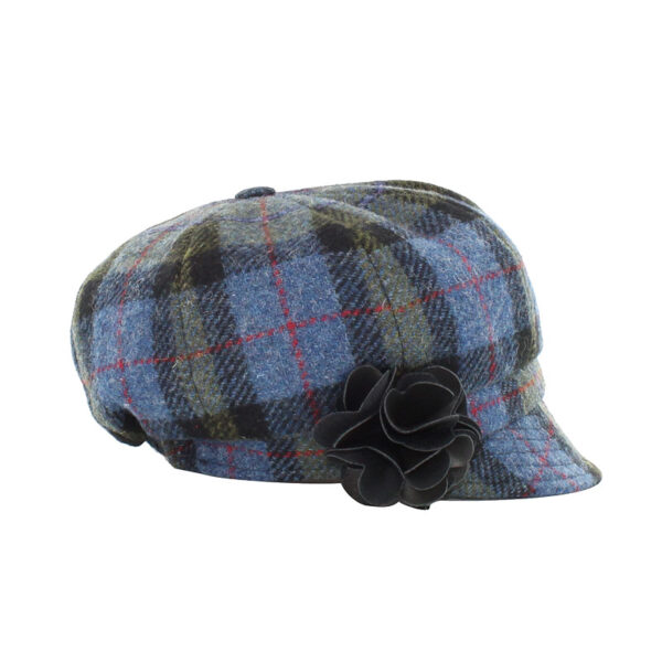 A blue plaid hat with flowers on top of it.