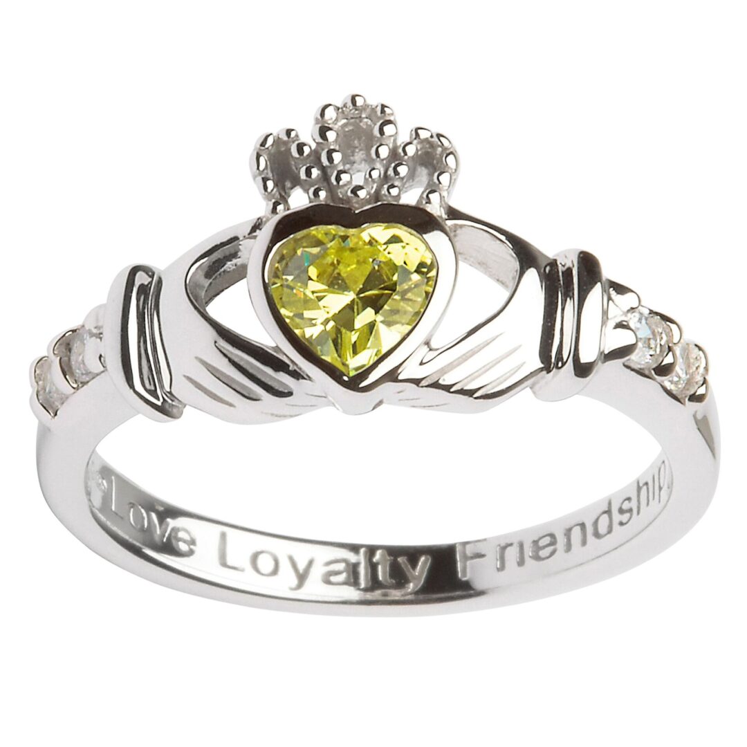 A claddagh ring with the words loyalty, friendship and love engraved on it.