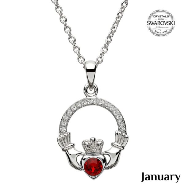 A claddagh necklace with a red heart in the center.