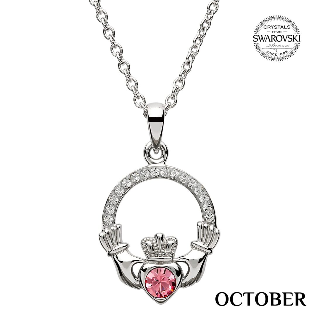A claddagh necklace with pink crystal heart.