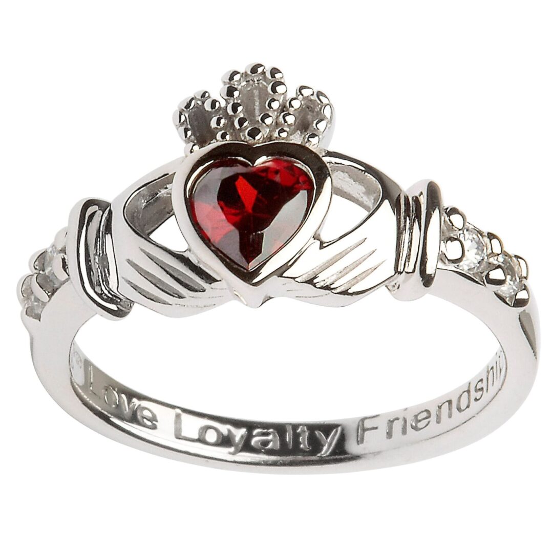 A claddagh ring with the words loyalty and friendship engraved on it.