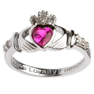 A claddagh ring with the words " live loyalty, friendship ," and " live loyalty, friends."