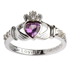 A claddagh ring with the words " love loyalty friendship ".