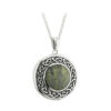 A silver necklace with a green stone in the center.