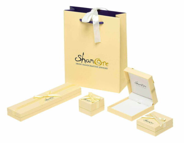 A bag of jewelry and boxes with the logo for shanore.