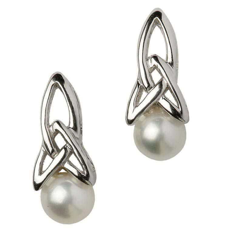 A pair of silver earrings with pearls.