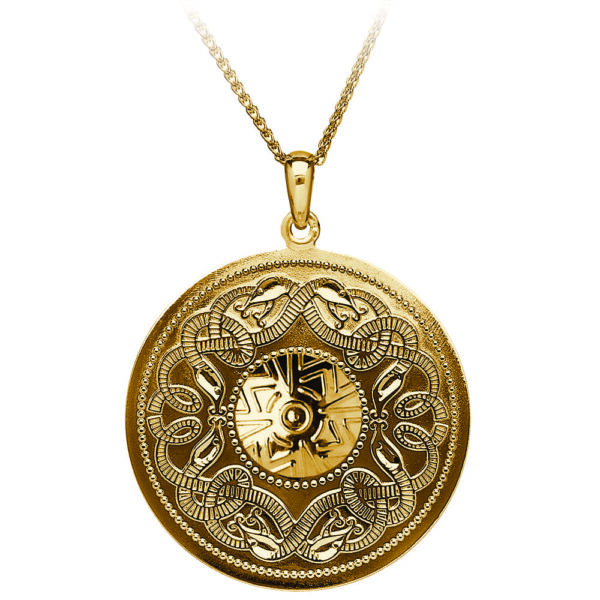 A gold and silver medallion with the image of a person 's face.