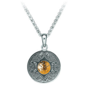 A silver necklace with a gold stone on it.