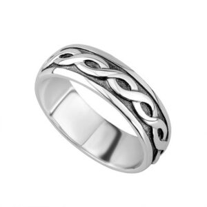 A silver ring with a celtic design on it's side.