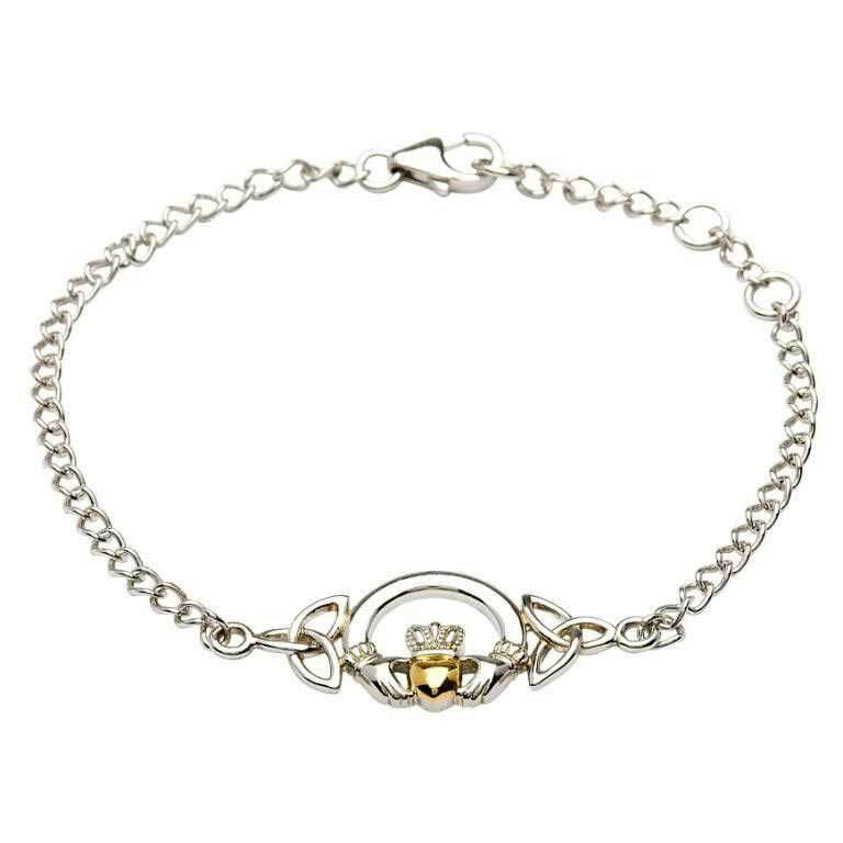 A silver bracelet with a claddagh and gold heart.
