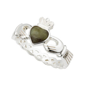 A claddagh ring with a heart shaped stone.