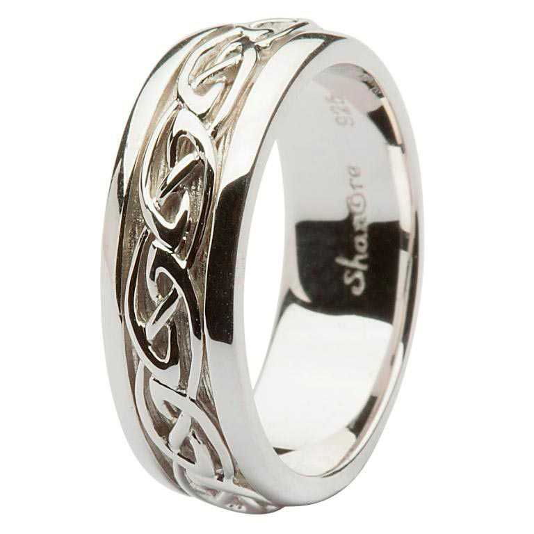 A silver ring with a celtic design on the side.