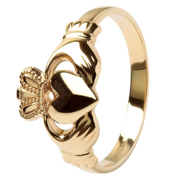 A gold claddagh ring with the crown on it's side.