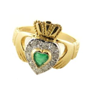 A gold claddagh ring with diamonds and an emerald heart.