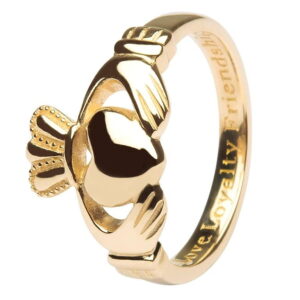 A gold claddagh ring with the words " irish blessing ".
