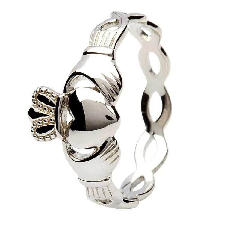 A silver claddagh ring with a chain around it.