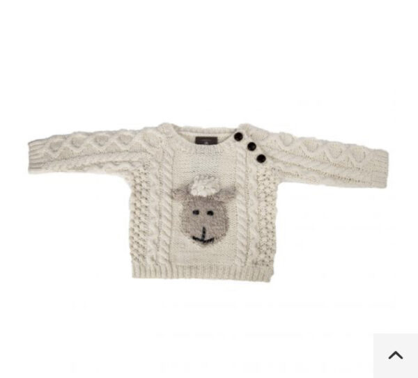 A white sweater with sheep on it.