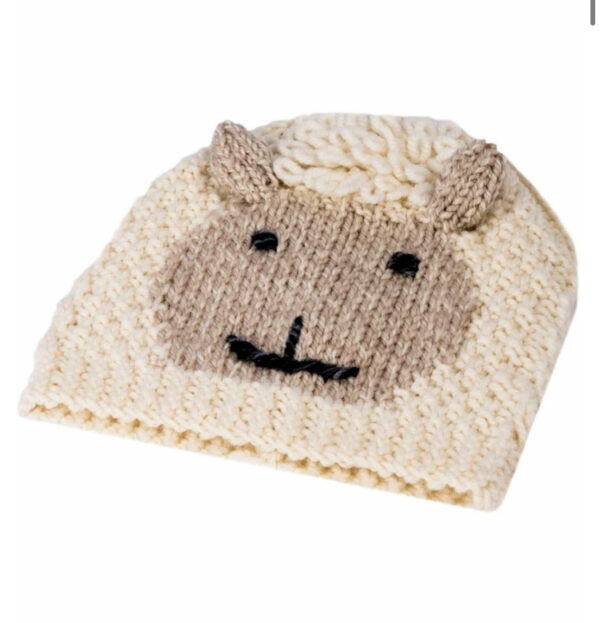 A knitted hat with an animal face on it.