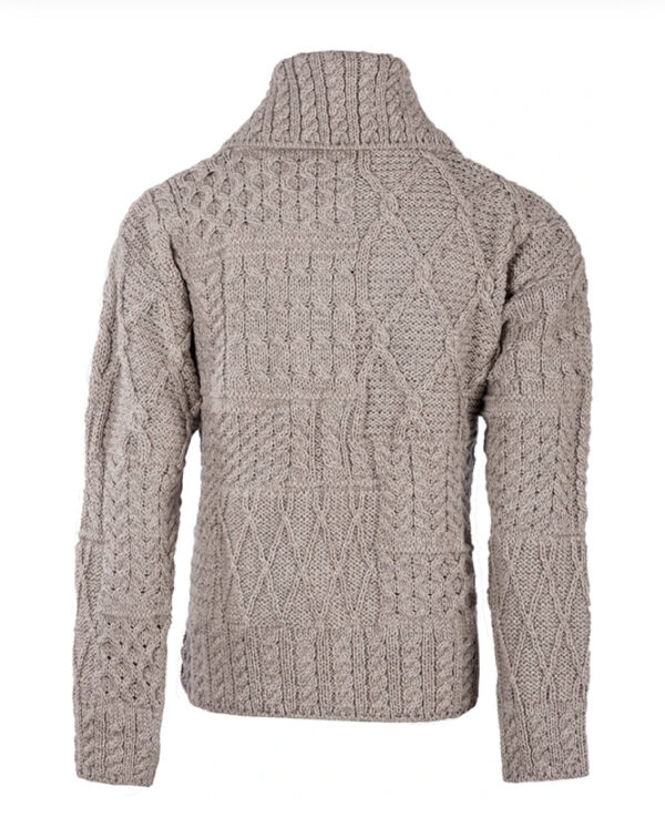 A sweater that is made of wool and has many different patterns.