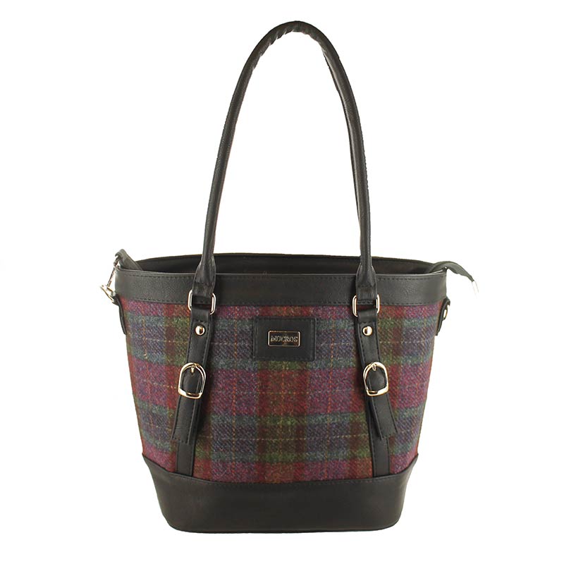 A brown and red plaid bag with black leather handles.