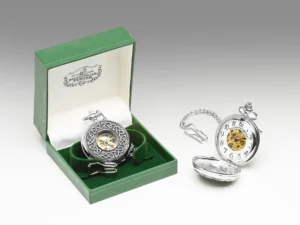 A silver pocket watch with a chain in it's box.
