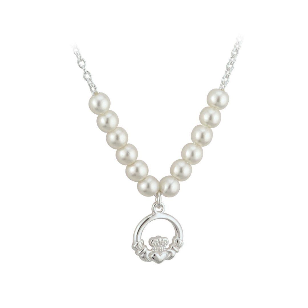 A white pearl necklace with a silver claddagh pendant.