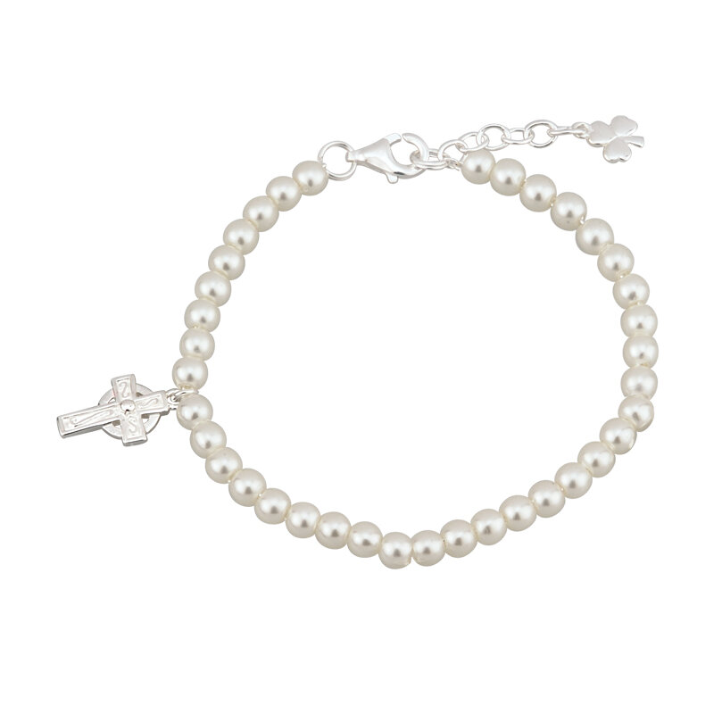 A bracelet with two crosses and pearls on it.
