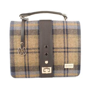 A brown and blue plaid bag with leather strap.