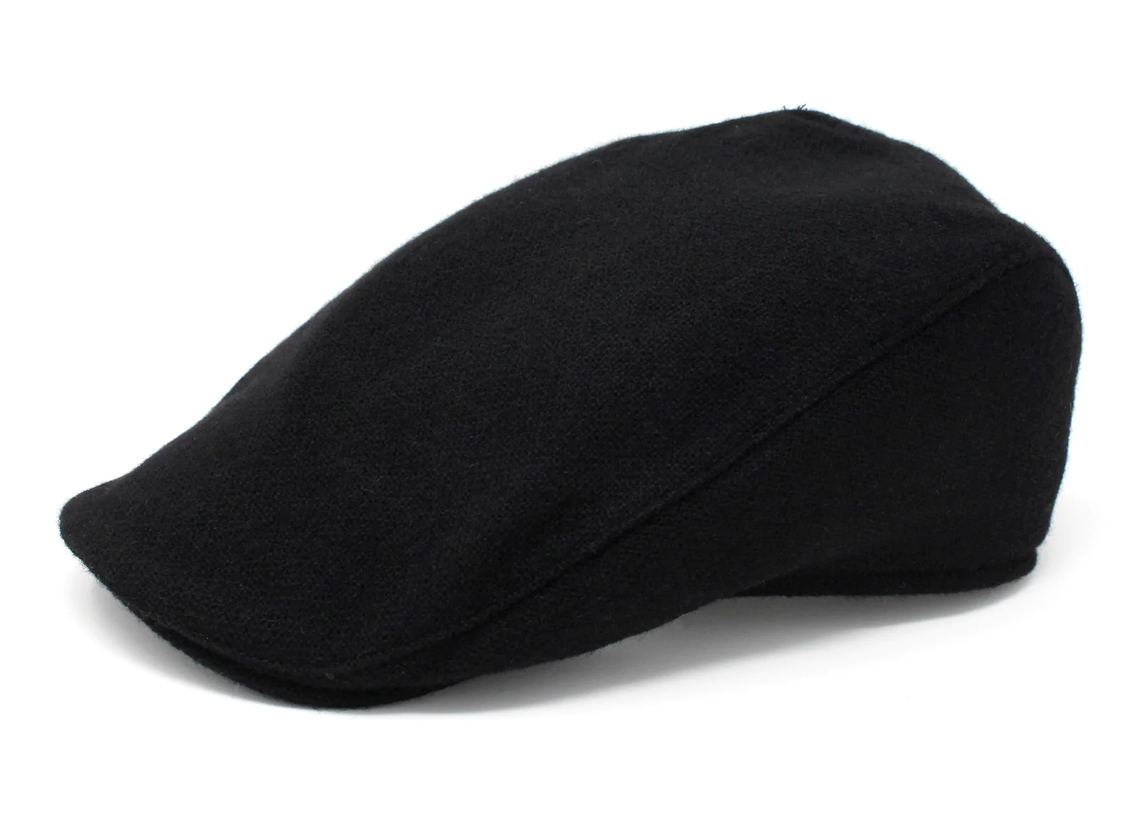 A black hat is sitting on the ground.