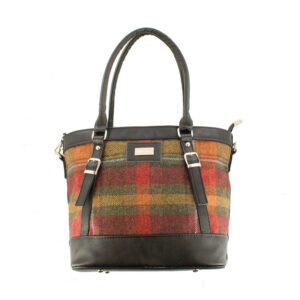 A brown and red plaid bag with leather handles.