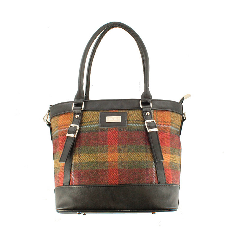 A brown and red plaid bag with leather handles.