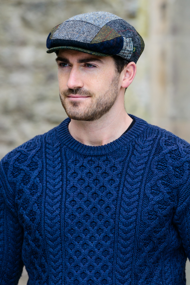 A man wearing a sweater and hat