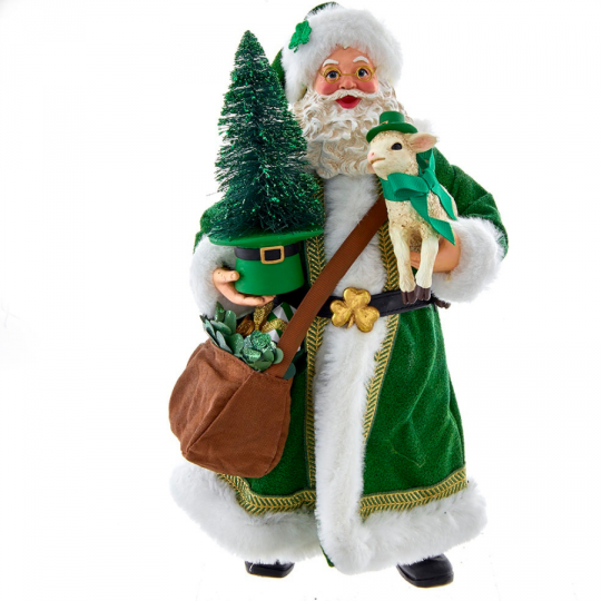 A santa clause doll with a bag of gifts and a tree.