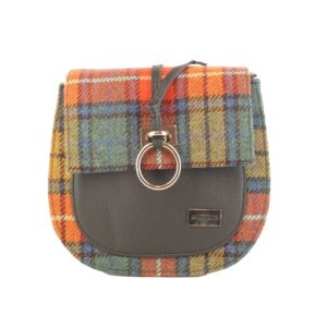 A small bag with a plaid pattern and leather strap.