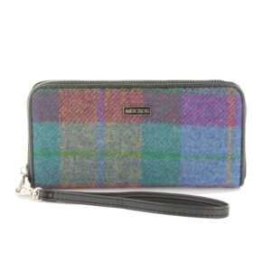 A multi colored plaid wallet with a wrist strap.