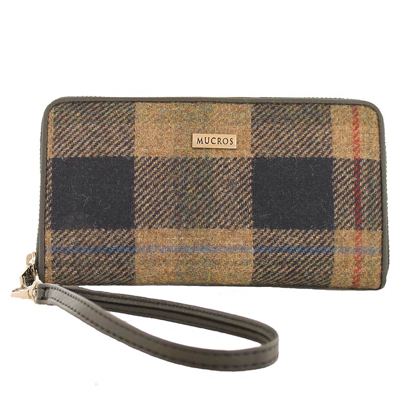 A brown plaid wallet with a wrist strap.