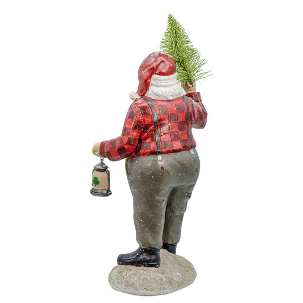 A gnome holding a christmas tree and a lantern.