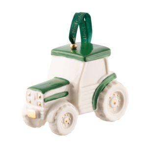 A green and white tractor ornament is hanging.