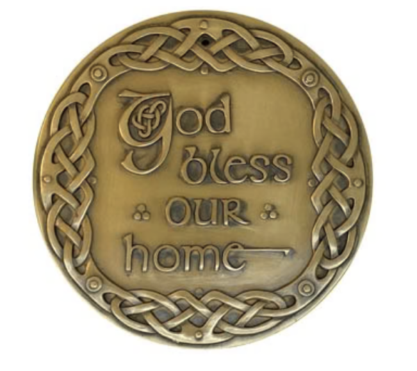 A plaque with the words god bless our home on it.