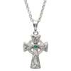 A cross with a green stone on it's side.