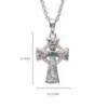 A cross with a green stone on it's side.