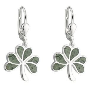 Silver earrings shaped like four-leaf clovers with green accents.