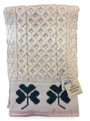 White knit blanket with shamrock pattern.