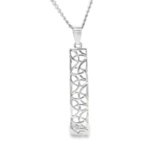 Silver pendant with intricate geometric design.