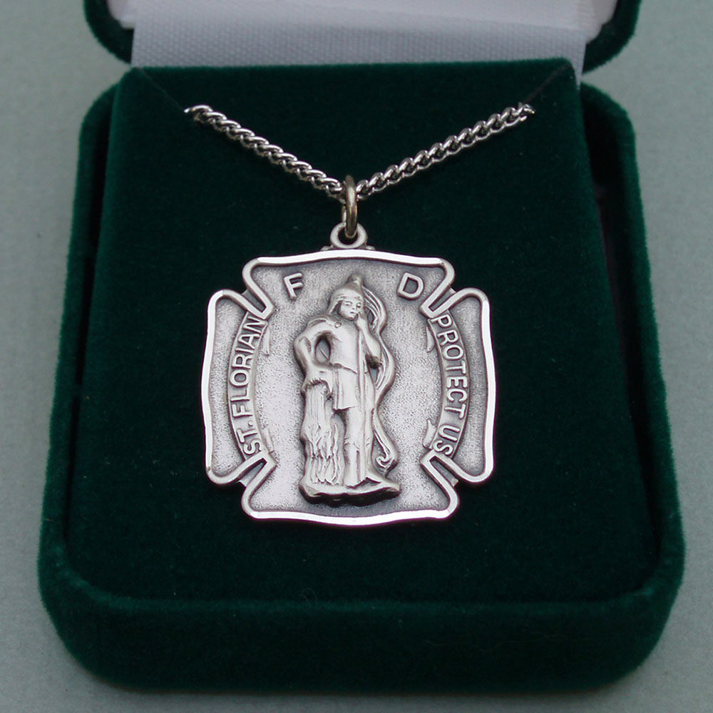 A silver medal with the image of st. Florian on it
