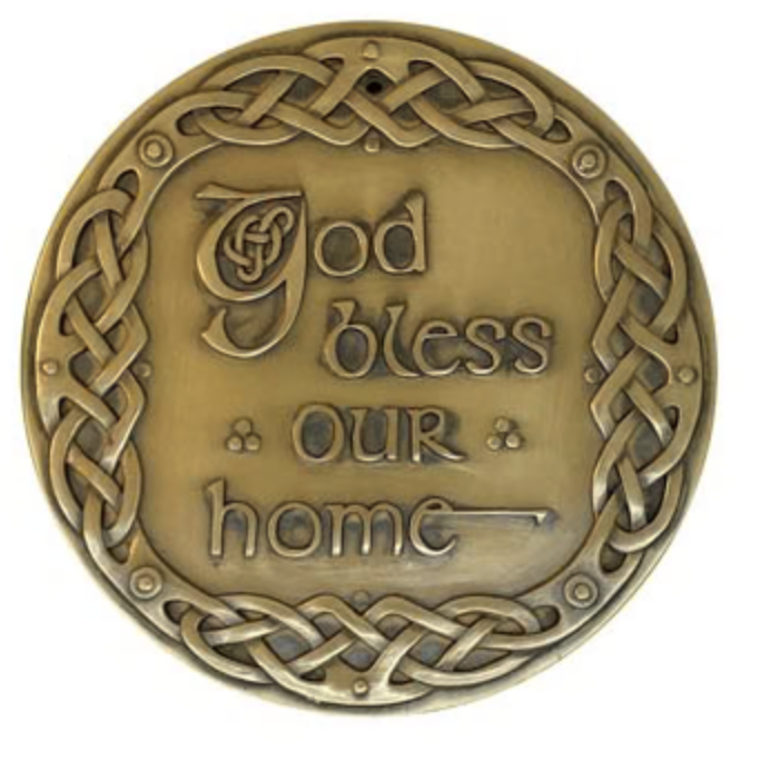 A plaque with the words god bless our home on it.