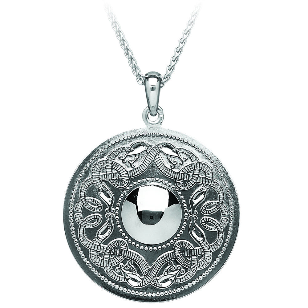 A silver necklace with a round pendant.