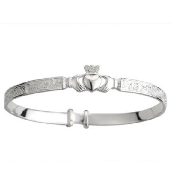 A silver claddagh bracelet with the irish symbols engraved on it.
