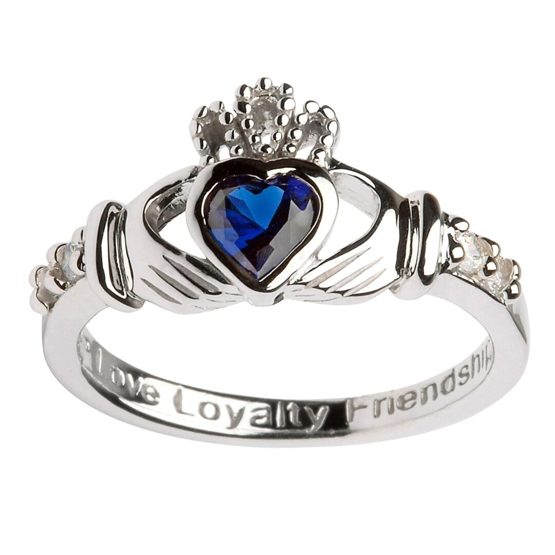 A claddagh ring with the words " love loyalty friendship ".